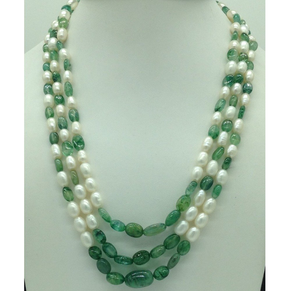 White oval pearls with green bariel...
